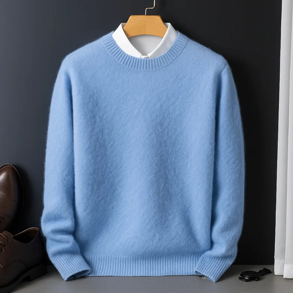 Sky blue knitted jumper on a wooden hanger, worn over a crisp white collared shirt, front view