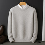 Light grey marl knitted jumper on a hanger, styled over a white shirt collar, front view