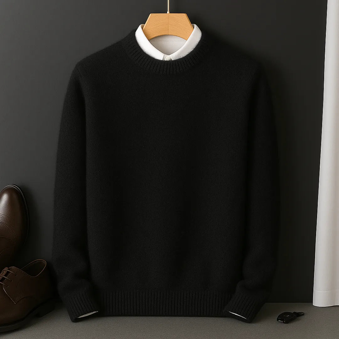 Black knitted jumper on a wooden hanger, layered over a white collared shirt, front view