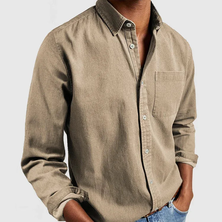 Close-up front view of a khaki tan long sleeve shirt with button placket and single chest pocket
