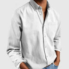 Light grey long sleeve shirt viewed from the front, showing the fabric texture and rolled cuff