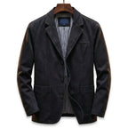 Black washed denim blazer on a wooden hanger, front view showing structured shoulders and three-button front