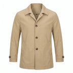 Beige trench coat shown from the front, fully buttoned, with pointed collar and horn-style buttons on a plain background