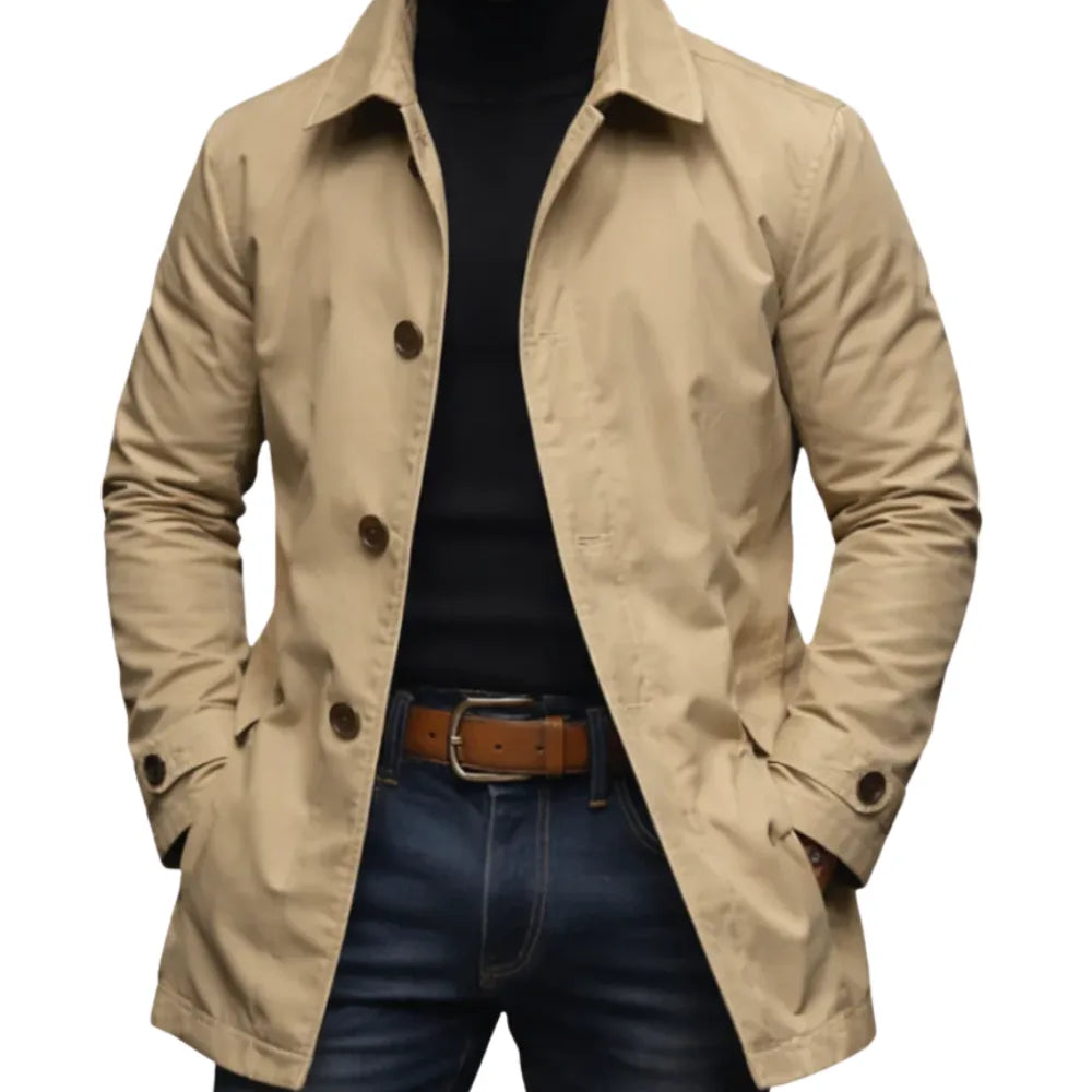 Close-up detail of the buttoned cuff tab on a trench coat sleeve, showing the button fastening