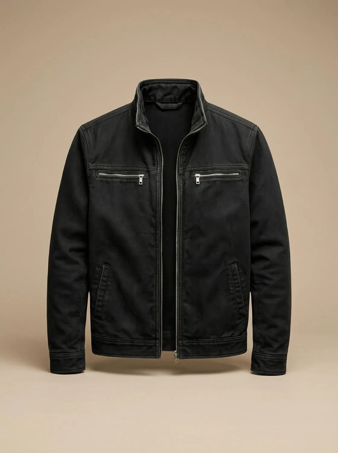 Black cotton jacket laid flat, fully unzipped, showing the stand collar and twin chest zip pockets