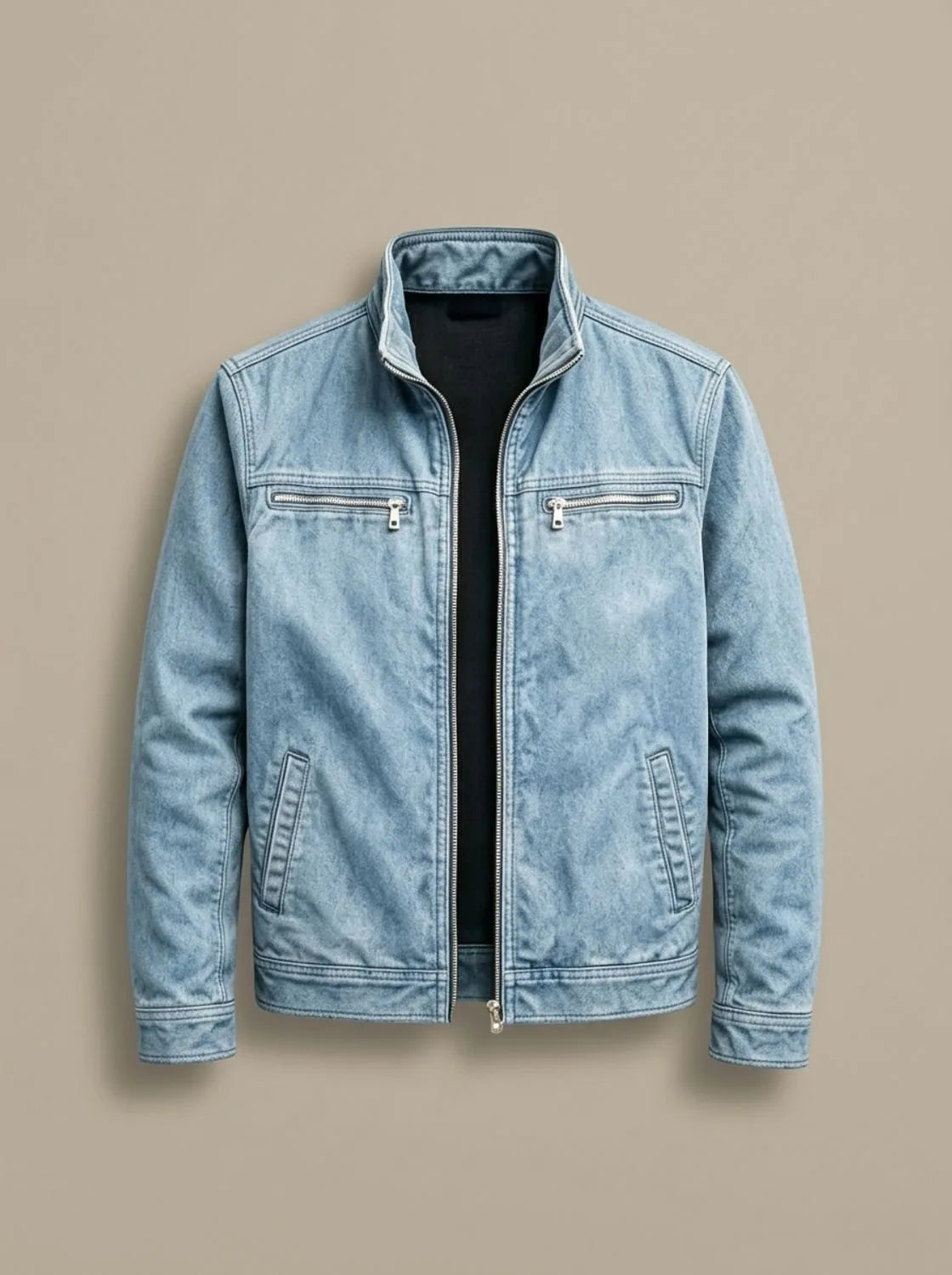 Light blue washed denim jacket laid flat, unzipped, showing stand collar and silver zip pulls