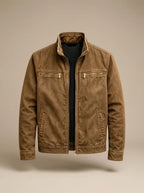 Tan brown cotton jacket laid flat, zipped, with brass-toned zip pulls and stand collar