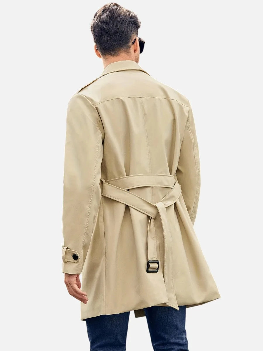 Rear view of the beige trench coat showing the belted back with buckle detail and centre seam