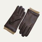 Brown leather driving gloves with tan ribbed knit cuffs, paired flat showing palm and back of hand
