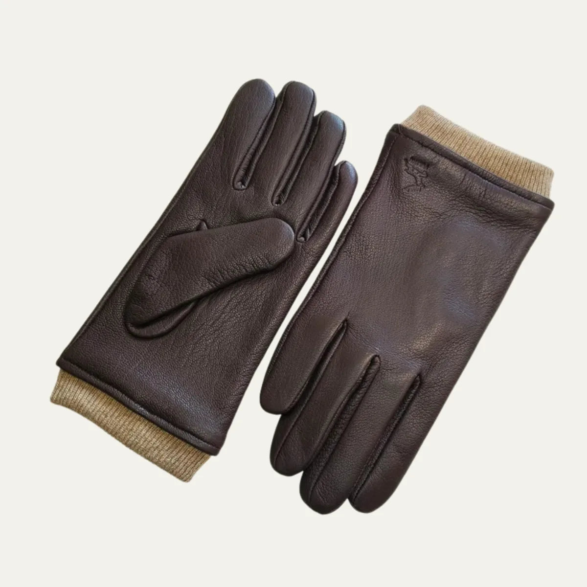 Brown leather driving gloves with tan ribbed knit cuffs, paired flat showing palm and back of hand