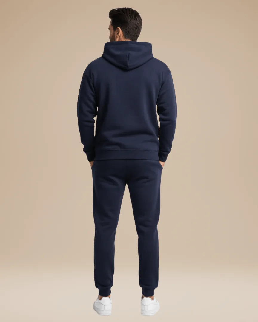 Back view of the navy tracksuit showing the fleece texture and straight hem