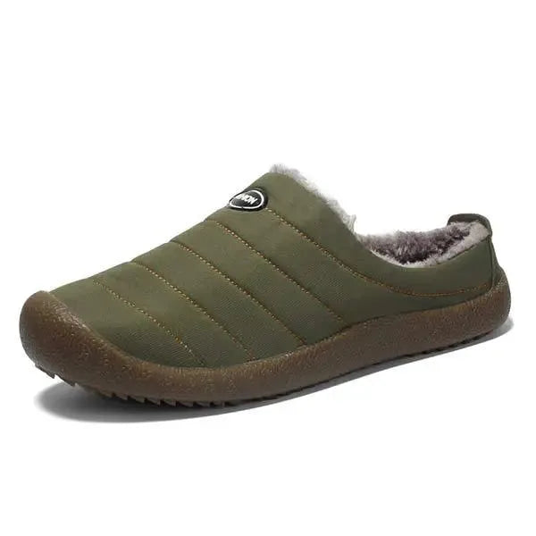 Side view of olive green quilted slipper with faux fur lining and brown ridged sole