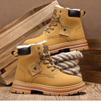 Pair of tan boots with plush cream faux fur lining shown resting against a wooden crate
