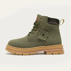 Side profile of a khaki green lace-up boot with contrast gum sole