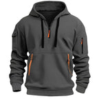 Dark grey marled hoodie with black drawcords, tan-trimmed zip pulls and front zippered pouch pocket