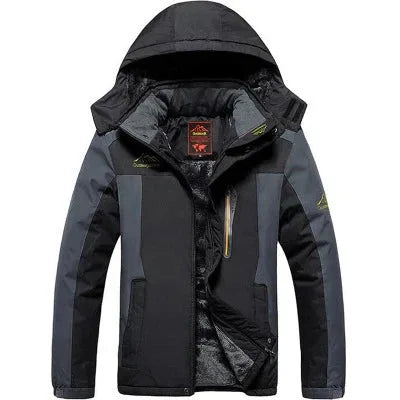 Black and grey padded ski jacket with fur-lined hood zipped up, front view showing chest pocket and zip pulls
