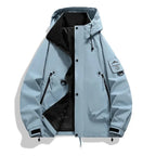 Pale blue hooded jacket laid flat, unzipped showing black lining, press-stud placket and adjustable hood toggles