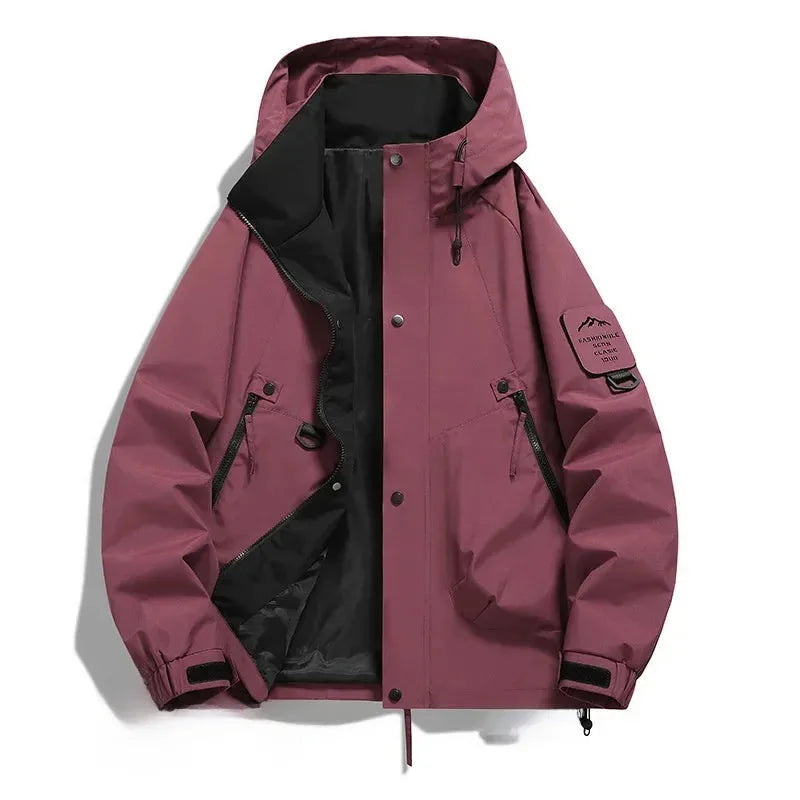 Burgundy red hooded jacket laid flat, unzipped showing black lining, structured hood and elastic cuff straps