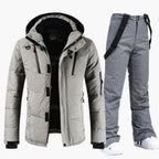 Light grey quilted hooded ski jacket matched with coordinating grey bib trousers