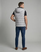 Back view of a man wearing the grey quilted hooded gilet, showing horizontal channel stitching across the shoulders