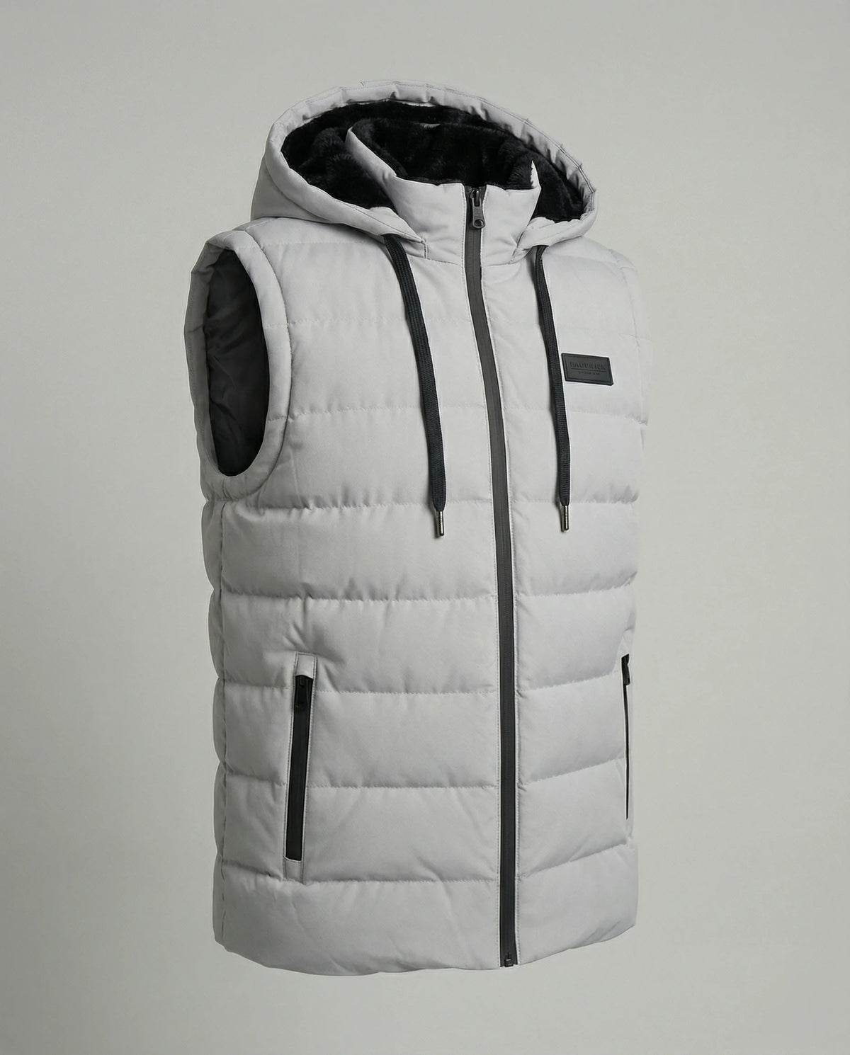 Product shot of a light grey hooded gilet with faux fur lined hood, zip pockets and branded chest patch