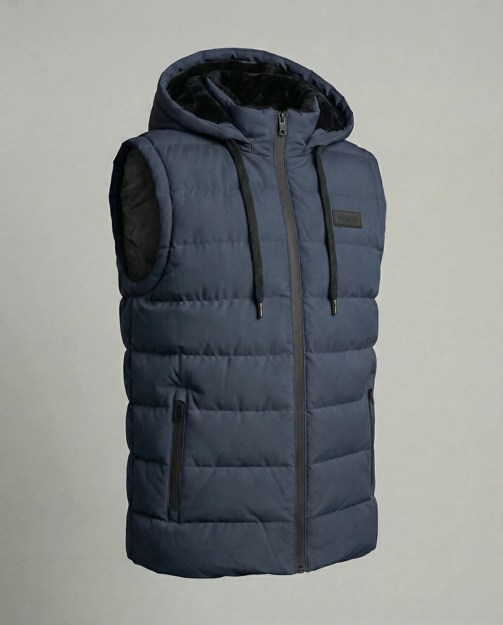 Product shot of a navy blue quilted hooded gilet with black faux fur lined hood and side zip pockets