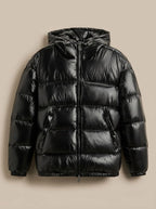 Detail shot of the silver zip pull and elasticated cuff on the hooded puffer jacket