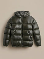 Flat lay of the glossy olive green puffer jacket with hood, zip and side pockets clearly visible