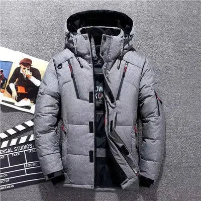 Grey quilted winter parka laid flat, showing stand collar, hood and dual zip chest pockets
