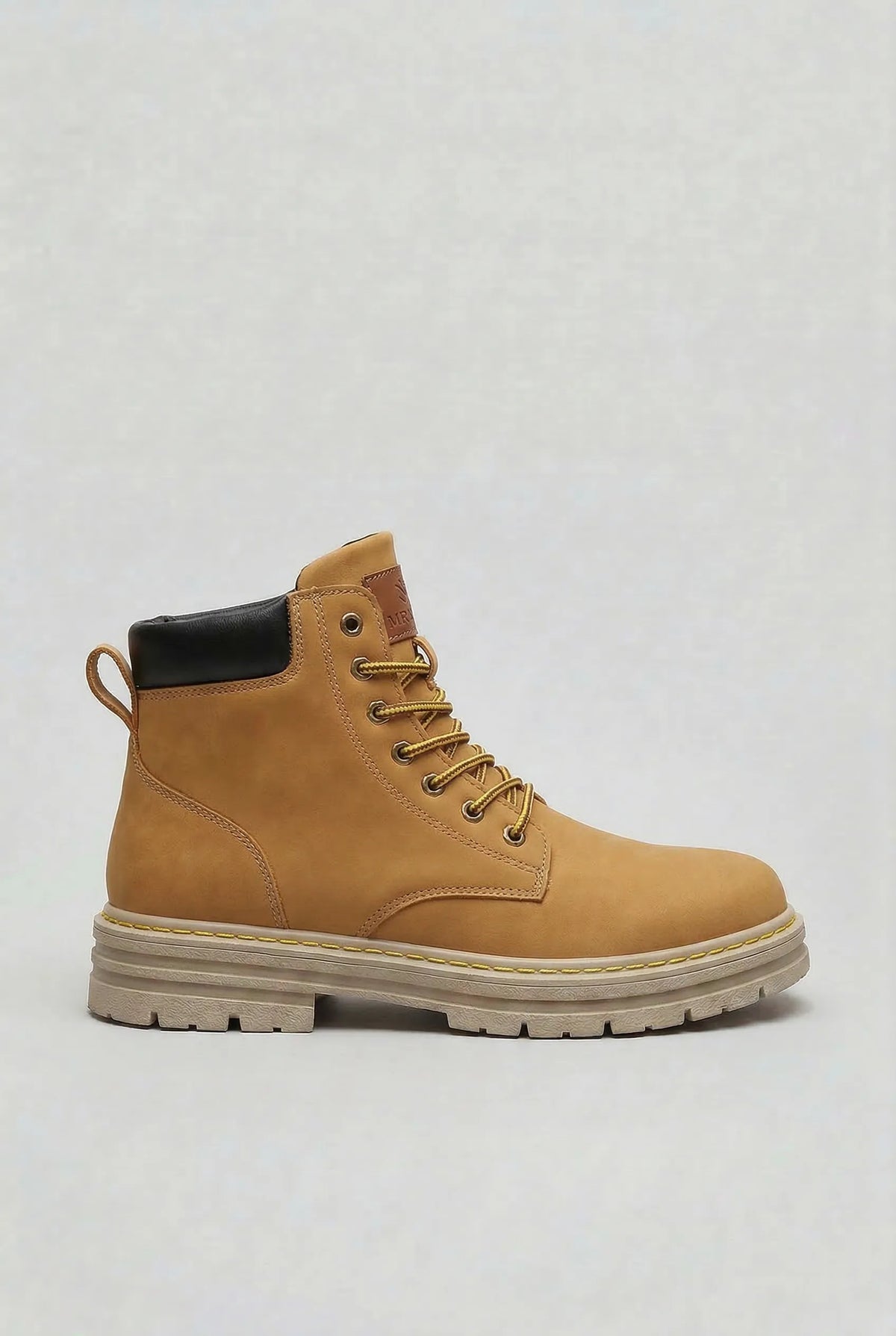 Side view of a tan lace-up ankle boot with yellow laces, black heel trim and a stacked cream sole