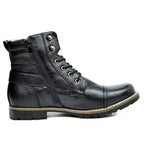 Side profile of a black lace-up boot with cap toe, side zip and stacked lug sole