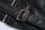 Close-up of the belt buckle and waist strap hardware on the black leather biker jacket