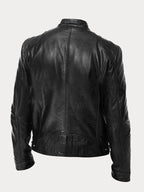 Back view of a black leather biker jacket highlighting the classic moto silhouette