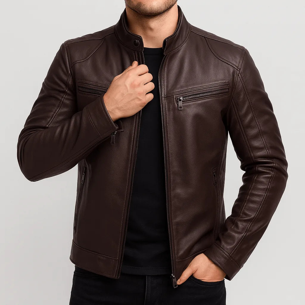 Brown leather motorcycle jacket with stand collar and quilted shoulder stitching, worn open over a black t-shirt