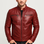 Burgundy leather motorcycle jacket with stand collar and front zip fastening, paired with a black t-shirt and jeans