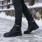 Close-up angle of black leather boot highlighting lace detail and chunky textured outsole