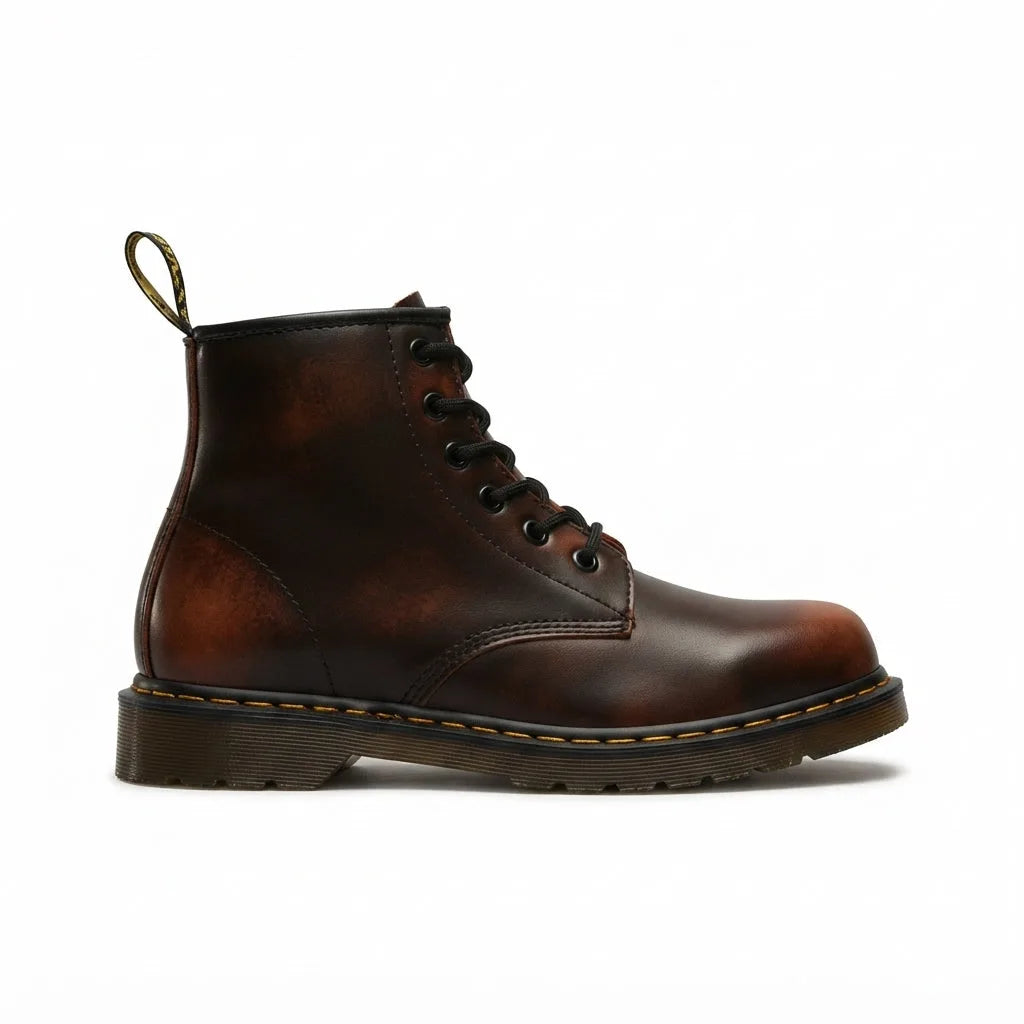 Side view of brown leather lace-up combat boot with ombré burnished finish and stitched cushioned sole