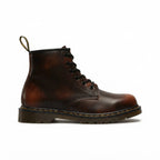 Side view of brown leather lace-up combat boot with ombré burnished finish and stitched cushioned sole