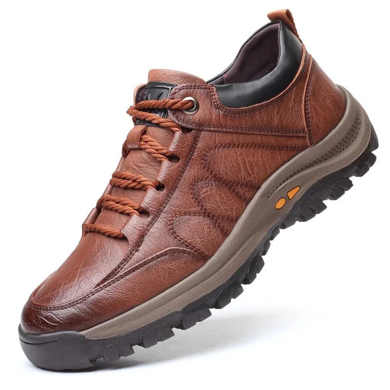 Angled view of a brown leather lace-up shoe with rugged lugged sole and contrast stitching