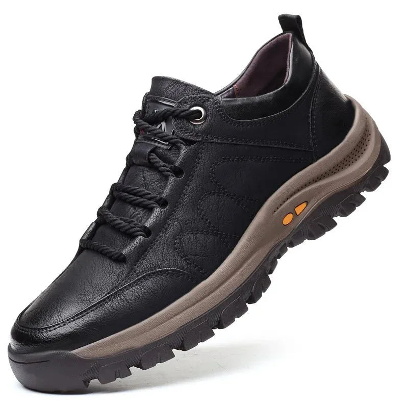 Side profile of a black leather lace-up shoe showing padded collar and chunky tread sole