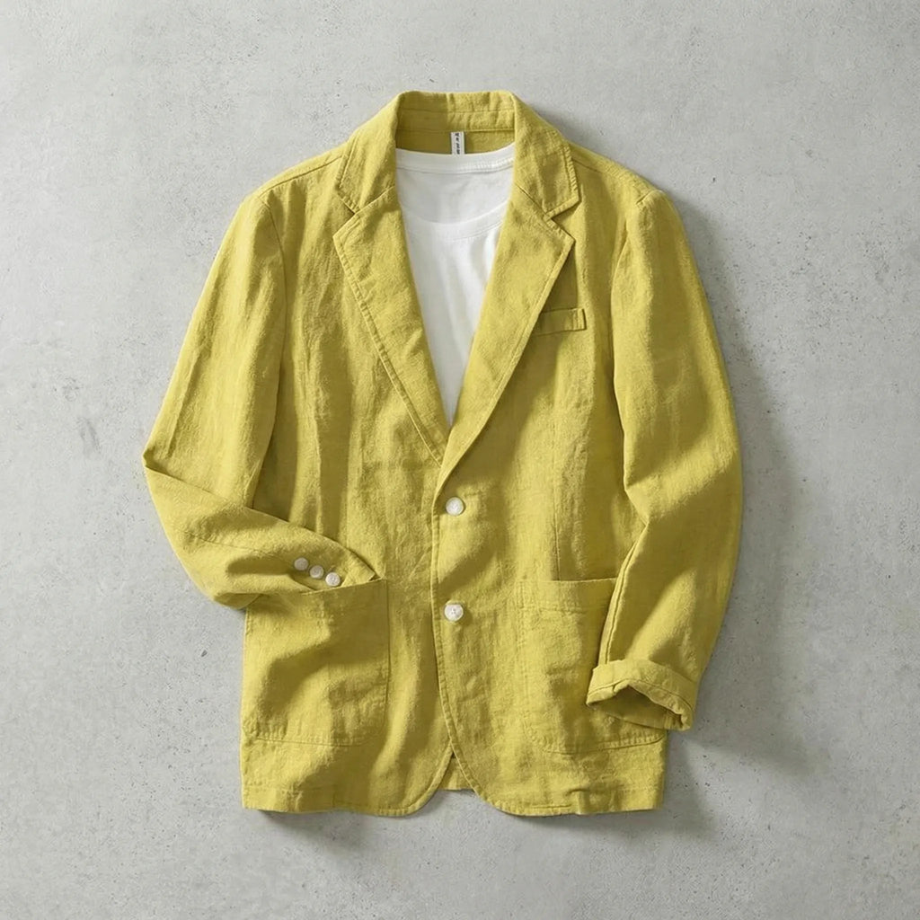 Mustard yellow linen jacket buttoned over a white t-shirt, showing pearl buttons and rolled cuffs