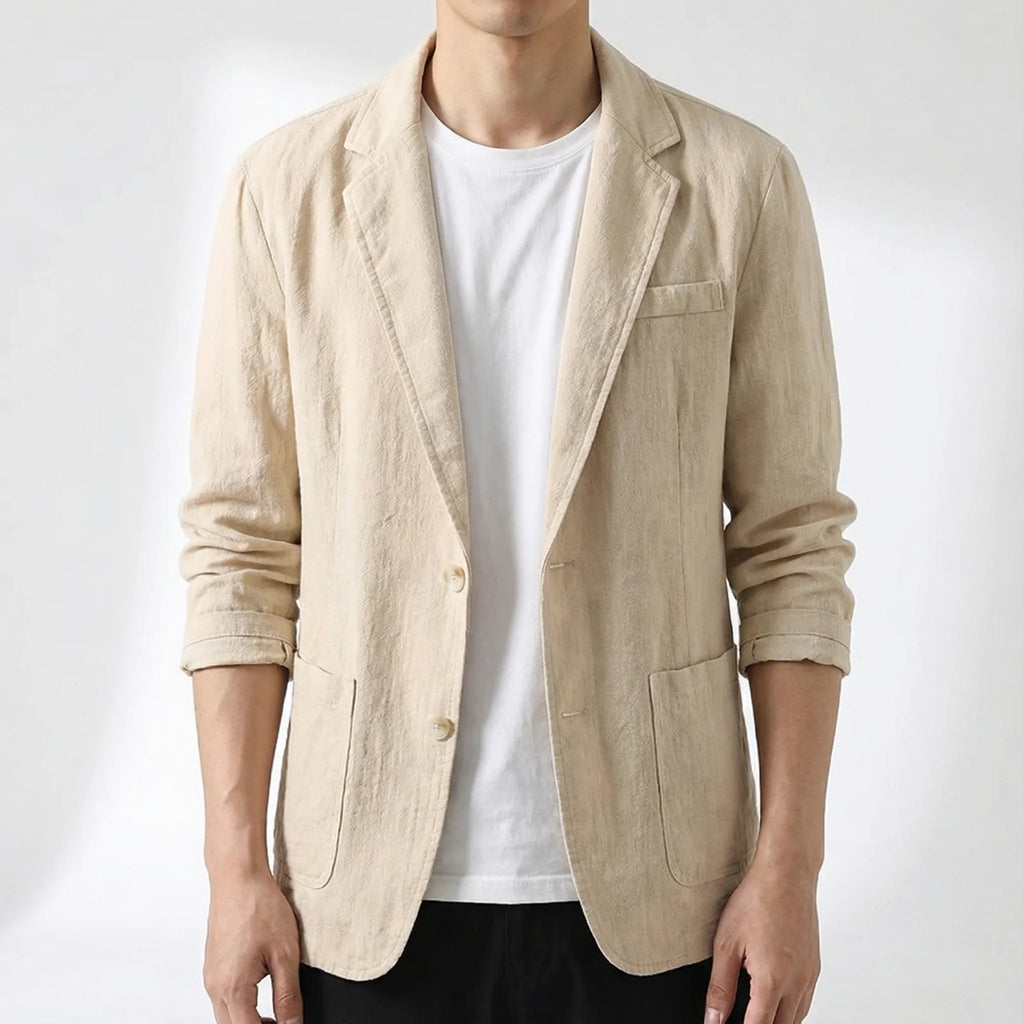 Man wearing the beige linen blazer open over a white t-shirt, close-up front view showing fabric texture