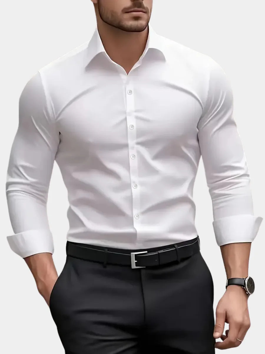 Close-up front view of a white long-sleeve button-down dress shirt with pointed collar and black belt over dark trousers