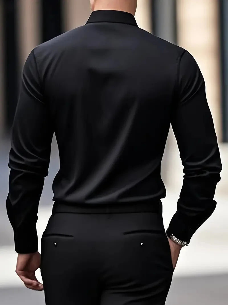 Dark grey shirt close-up of the collar and top button area against a blurred city background