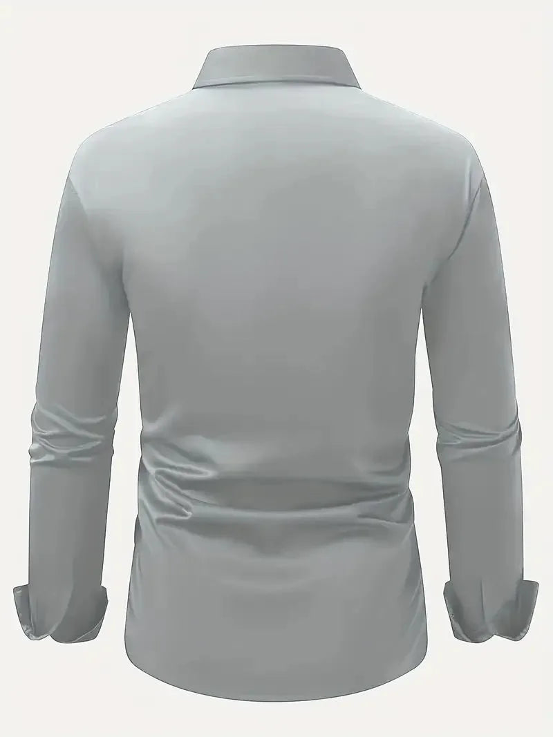 Light blue shirt detail showing the cuff and sleeve construction with a wristwatch visible