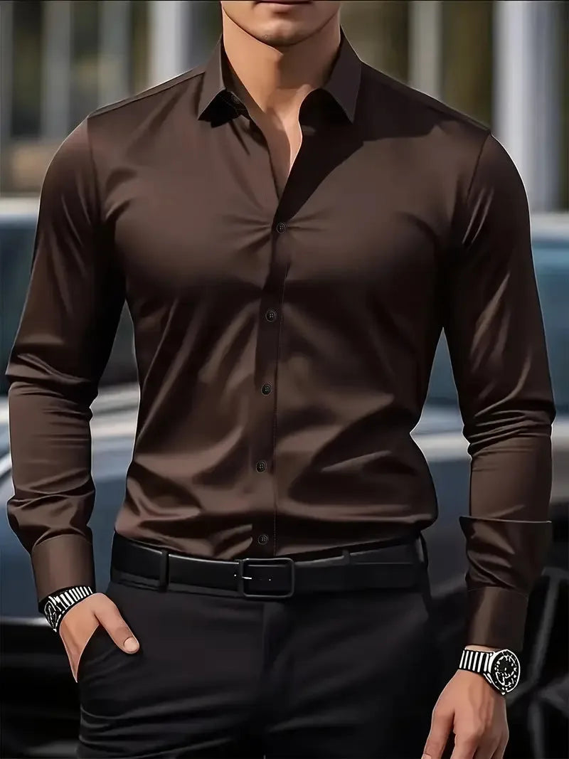 Dark brown long-sleeve button-down shirt with a glossy finish, worn with a black belt near a parked car