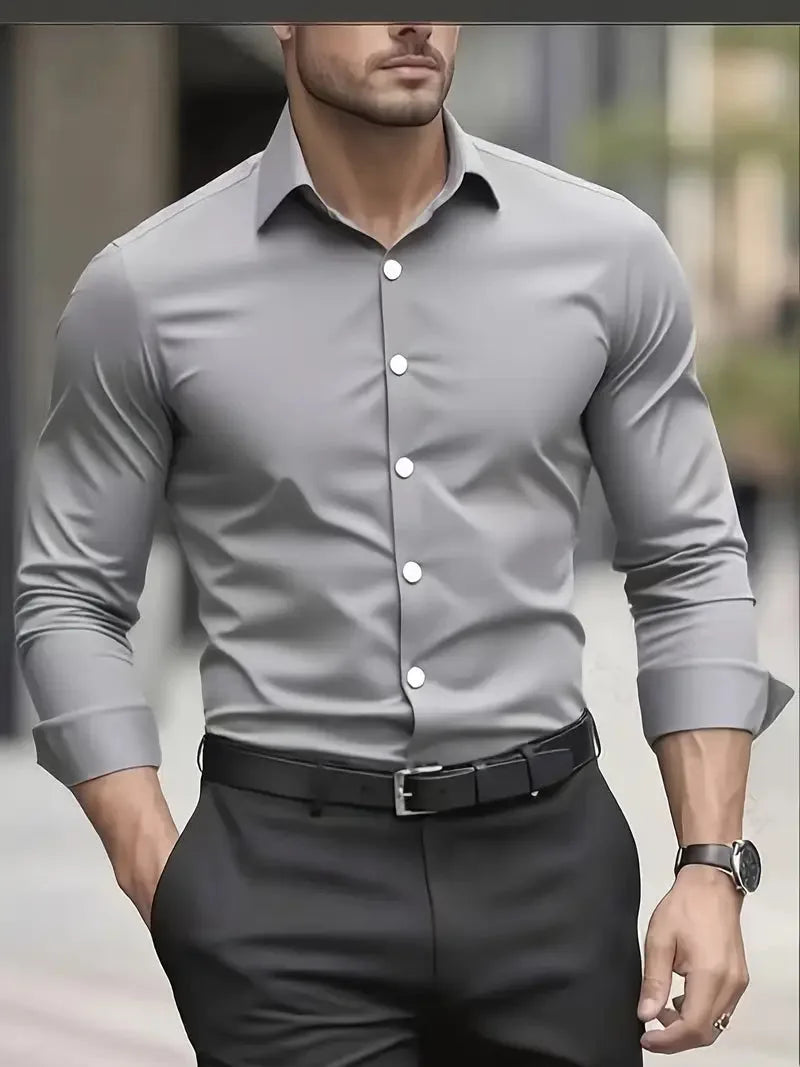Grey long-sleeve dress shirt with white buttons and structured collar, styled with a black leather belt