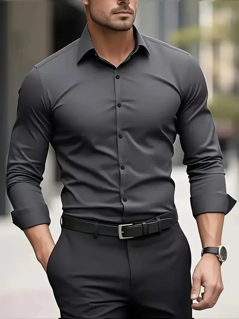 Dark grey long-sleeve button-down shirt with tonal buttons, worn fitted with a black belt and wristwatch