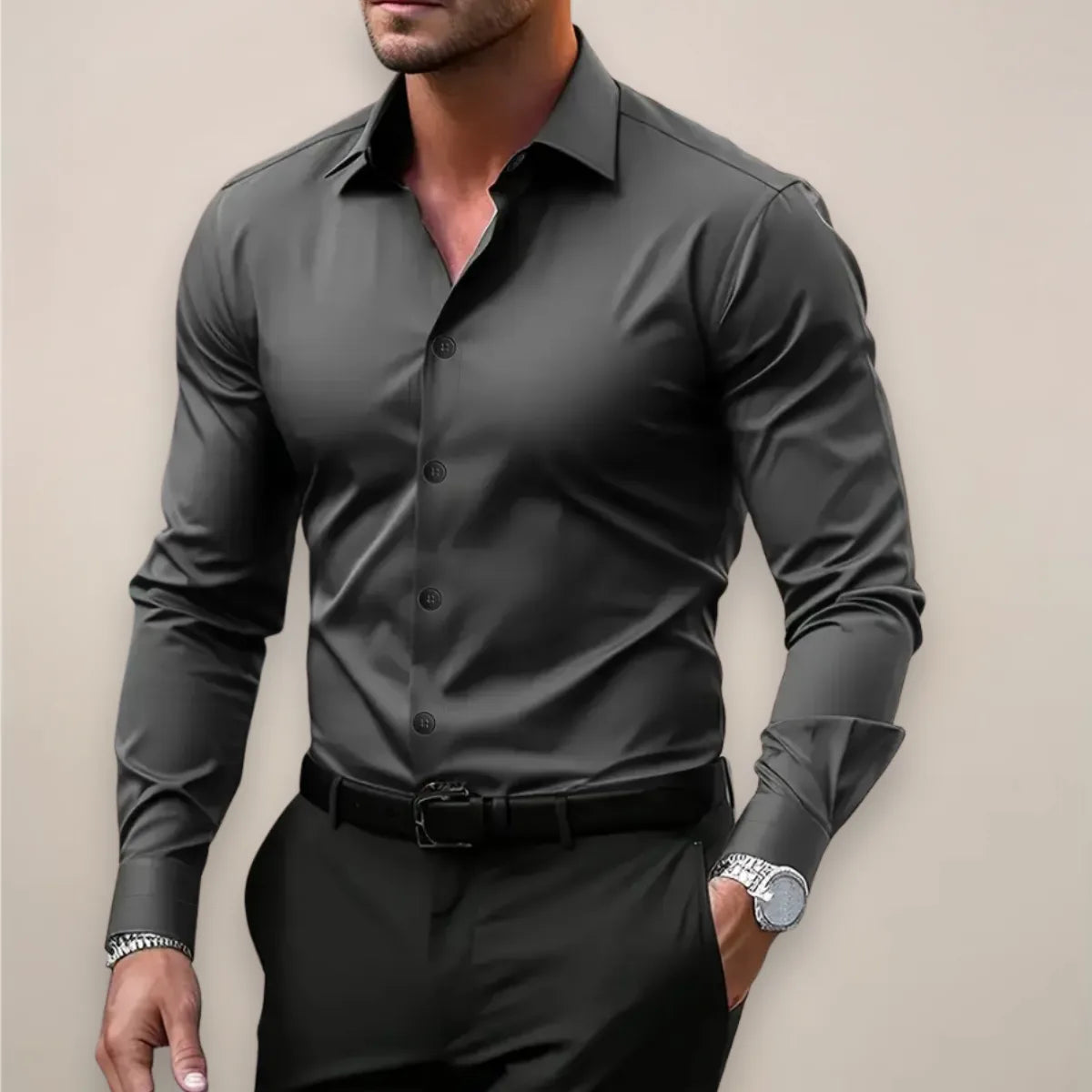 Dark grey long sleeve dress shirt with pointed collar, button-front closure and belted black trousers.