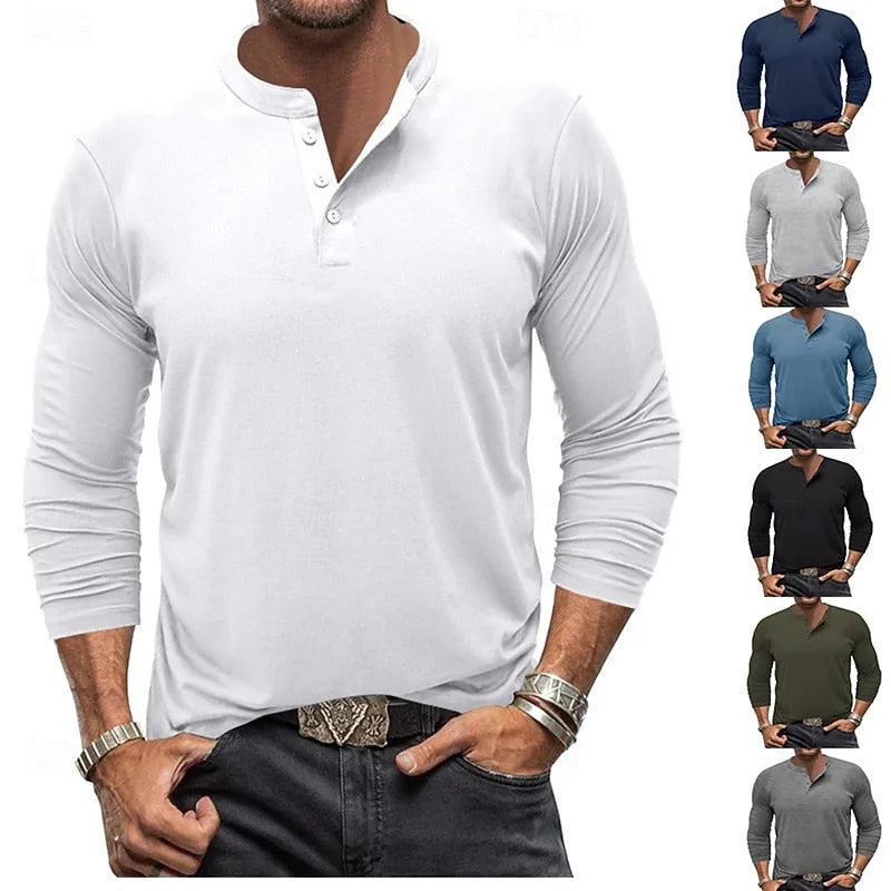 Front view of a man wearing a white long-sleeve henley with a three-button placket and stand collar, paired with dark jeans